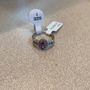 Size 7 silver ring with light purple stone never worn tag still on